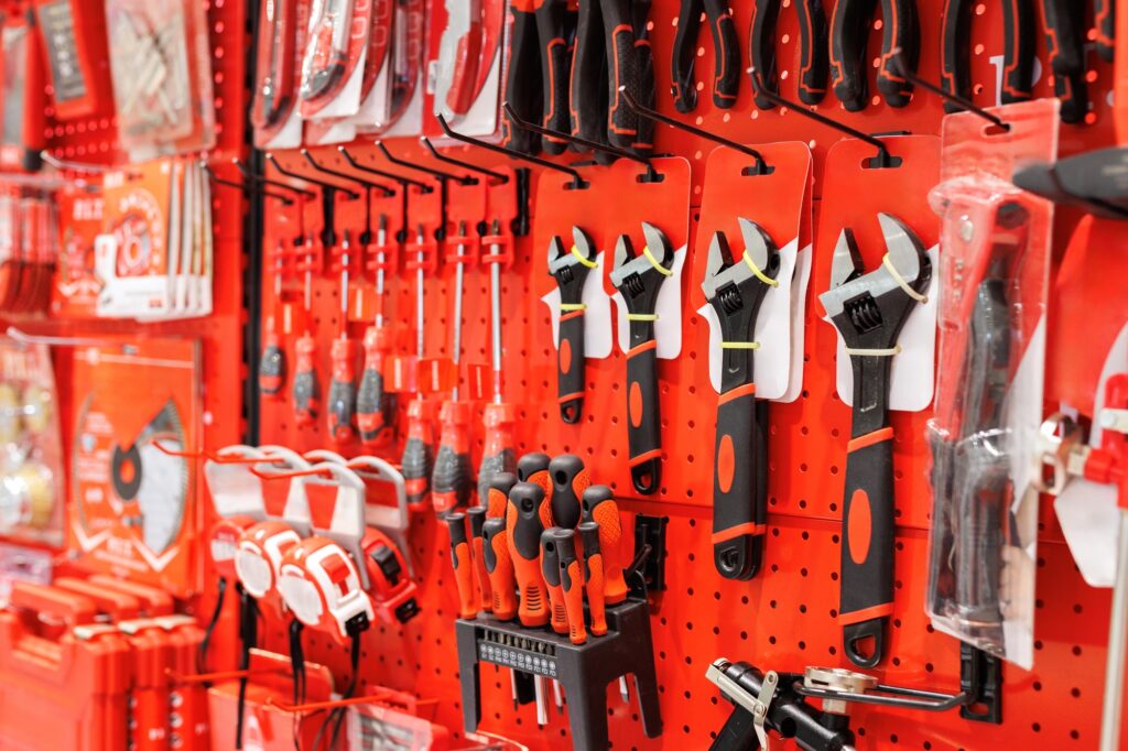 Various repair tools for sale on hardware store showcase.